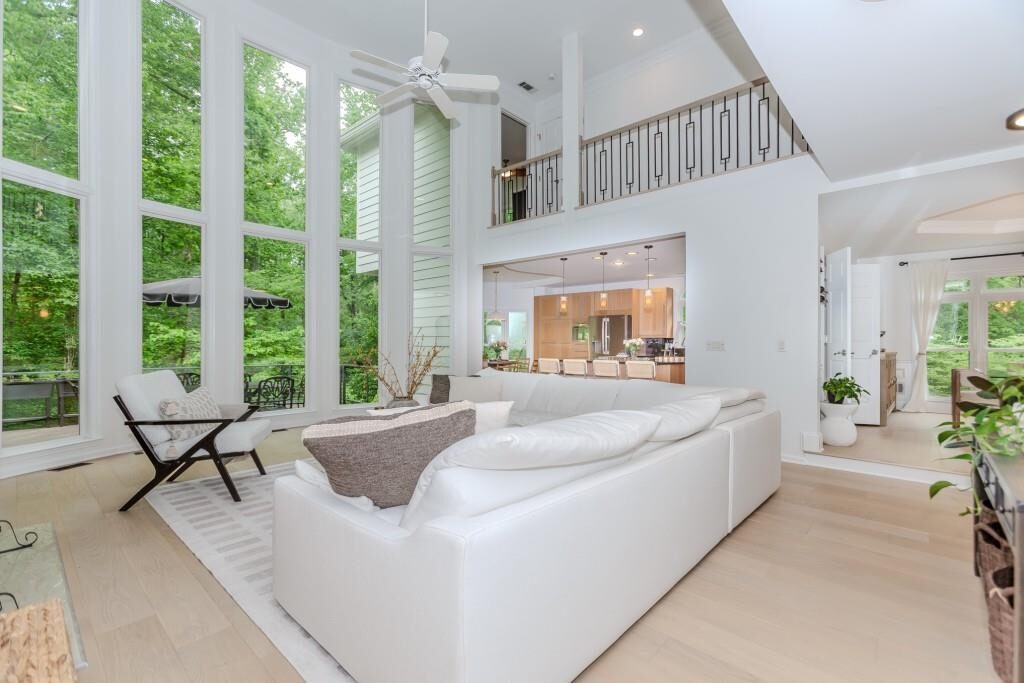 Two-story family room with floor-to-ceiling windows in Birkdale, Alpharetta