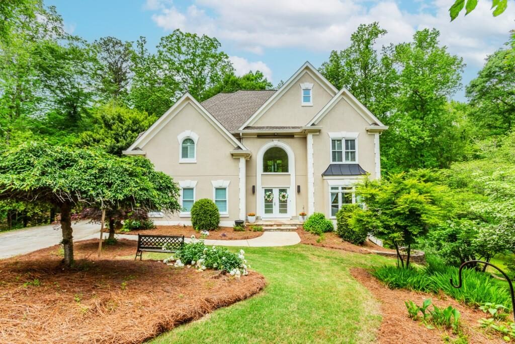 Front of the home among mature trees