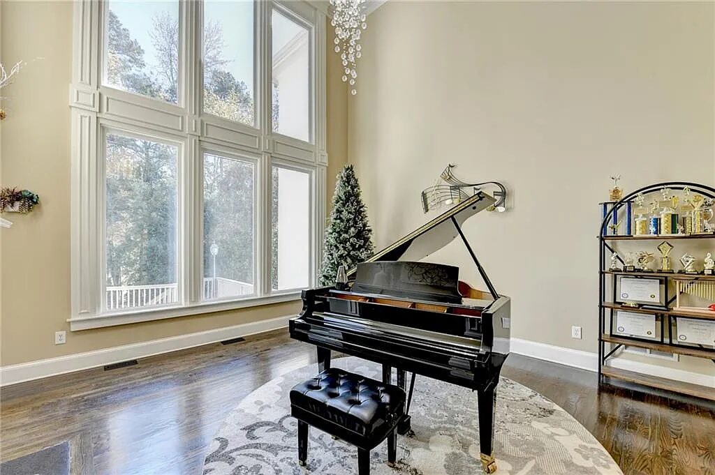 Two-story living room with a wall of windows